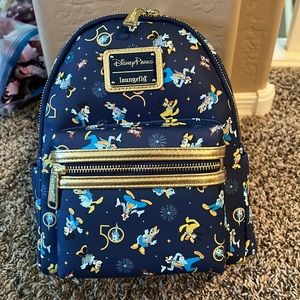 Walt disneyworld Loungefly backpack purse. New with tags. 50th anniversary.